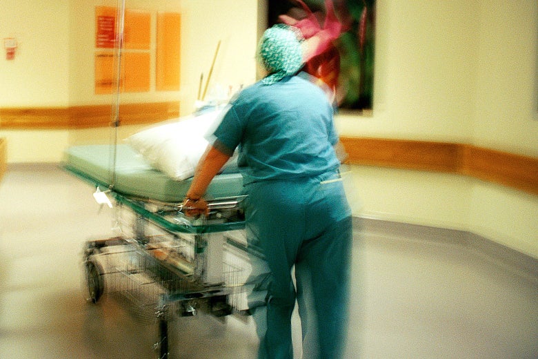 A nurse pushing a gurney through a hospital hallway stylized in a blurry, shaken way.
