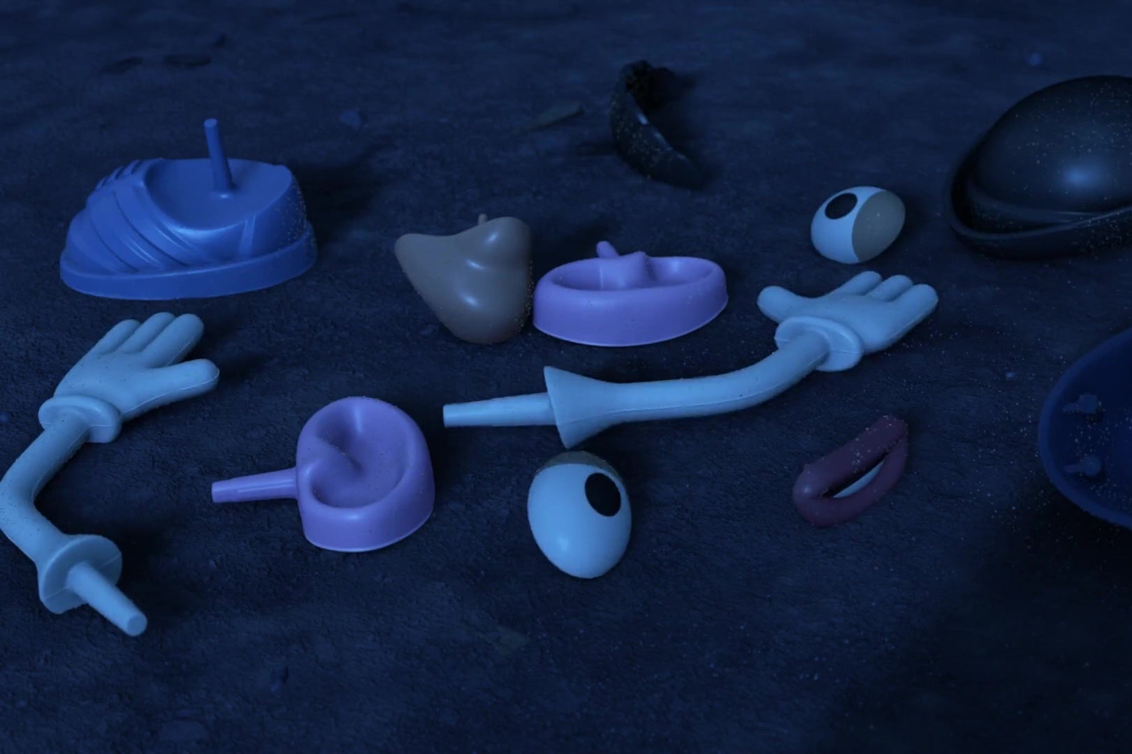 A bunch of Mr. Potato Head pieces spread out on a carpet.
