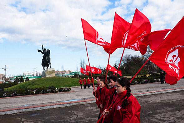 Young members of the communist party march on the 96th anniversary of the Russian Revolution. Tiraspol, Moldova