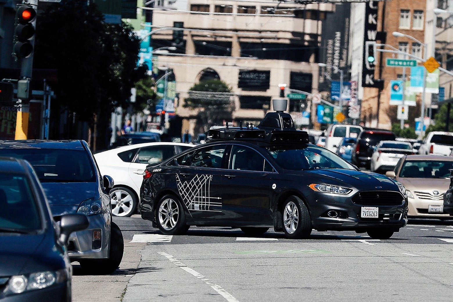 An Uber self-driving car drives down Fifth Street in San Francisco.