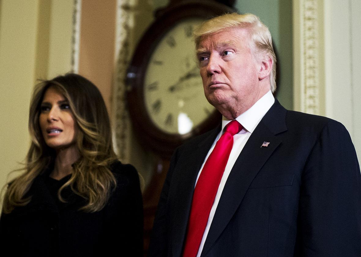 President-elect Donald Trump, takes a few questions from the press as he leaves with his wife Melania Trump escorted by Senate Majority Leader Mitch McConnell, after their meeting in Leader McConnell's office in the U.S. Capitol on Thursday, Nov. 10, 2016. 