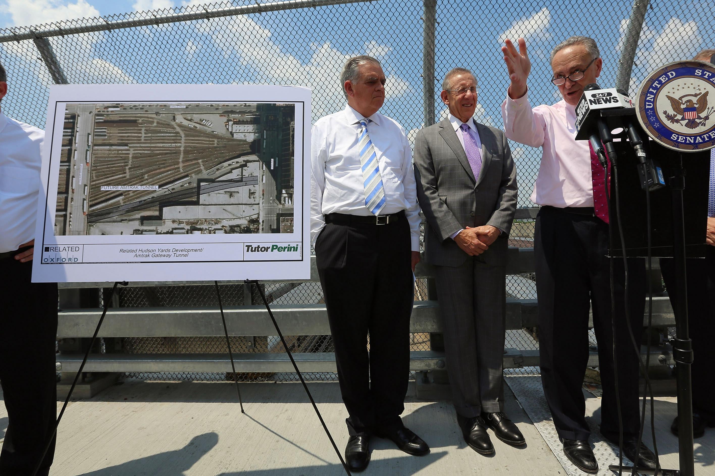 NEW YORK, NY - MAY 30:  (R-L) U.S. Sen. Charles Schumer (D-NY) (R) speaks as Hudson Yards developer Stephen Ross and (C) and U.S. Transportation Secretary Ray LaHood look on at a news conference at the Hudson Yards site in Manhattan on May 30, 2013 in New York City.  LaHood said $185 million in Federal Transit Administration funds will be used to construct an encasement around two proposed train tunnels at the site in order to prevent the type of tunnel flooding that happened during Hurricane Sandy as part of the larger 'Gateway' Amtrak tunnel project.  (Photo by Mario Tama/Getty Images)