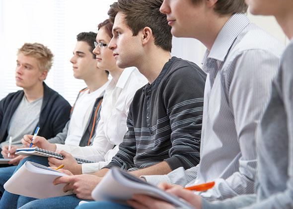 Group of college students attending a lecture.
