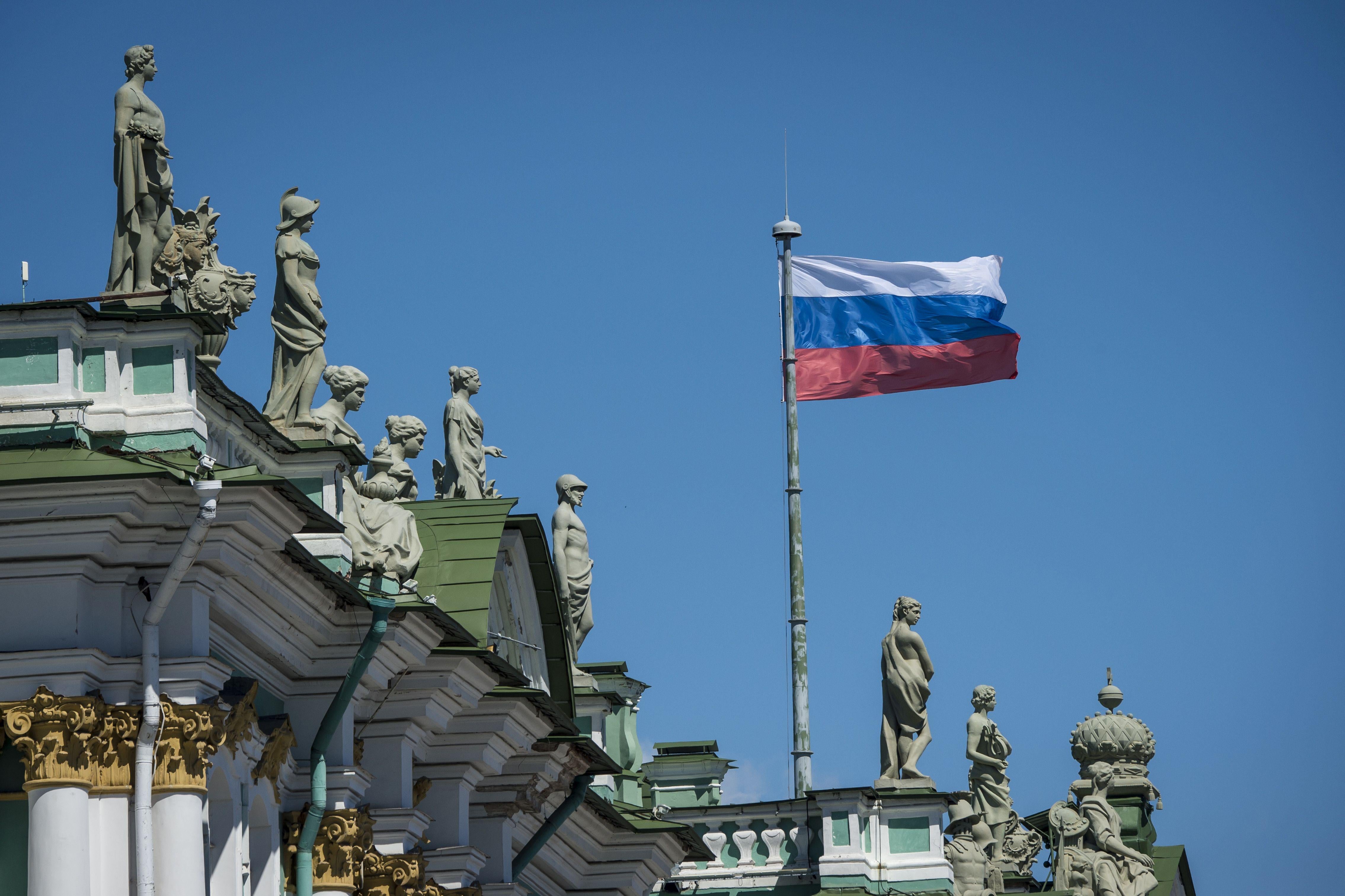 A Russian flag flies over a building.