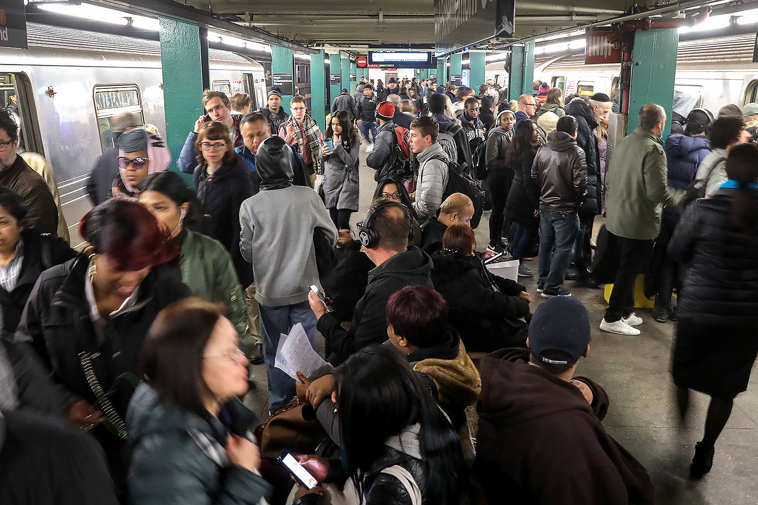A crowded subway station at rush hour in New York City.