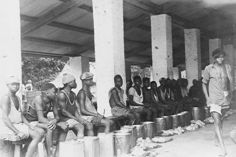 Tappers gathered at a collecting station in Liberia in the early 1940s.