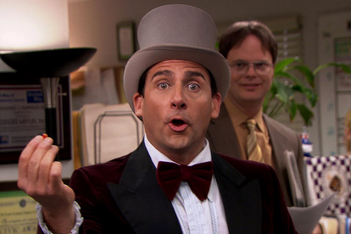 Steve Carell in The Office wears a bowler hat and bow tie.