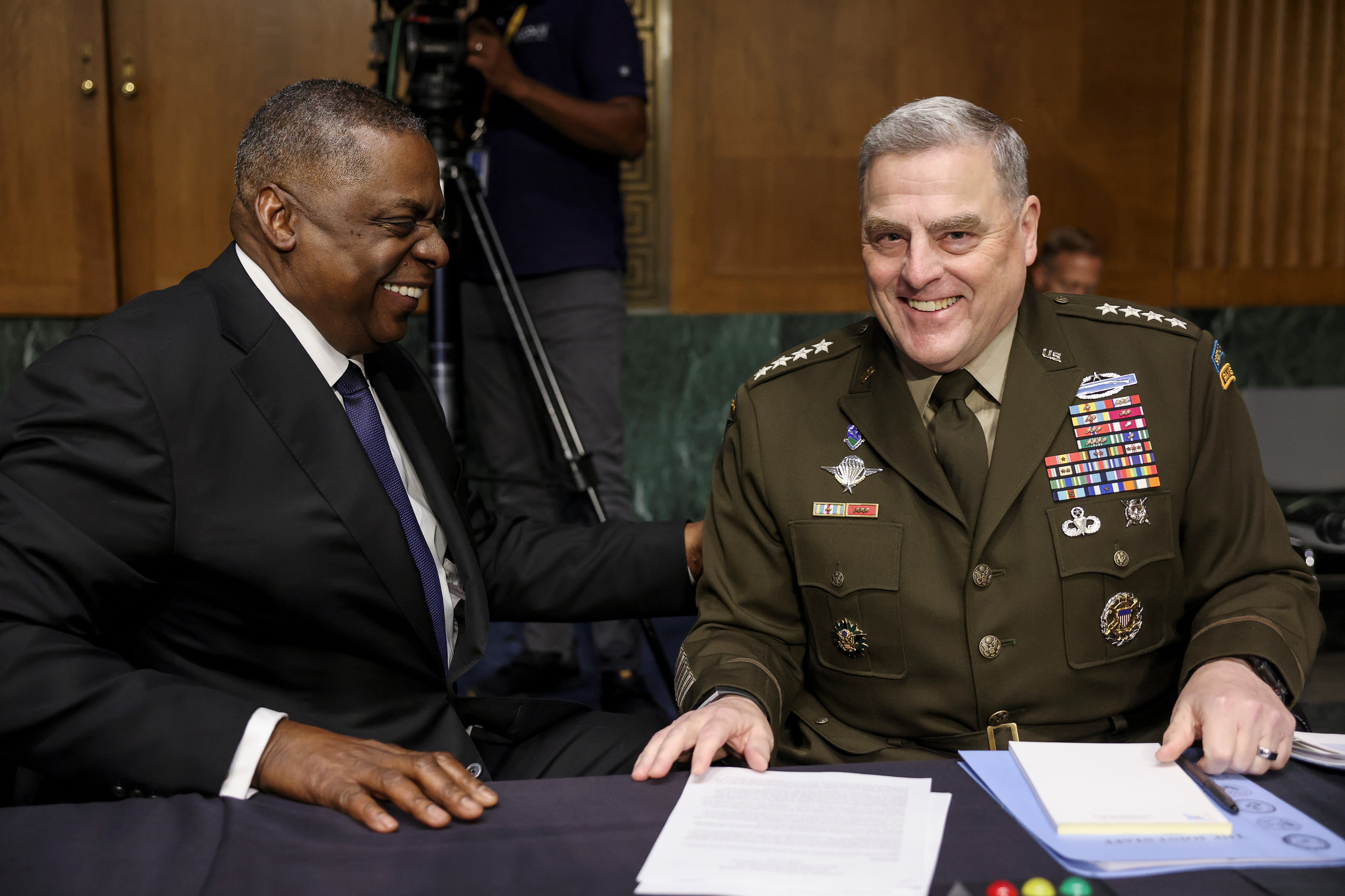 U.S. Defense Secretary Lloyd Austin laughs with Joint Chiefs of Staff Chair Gen. Mark Milley during a break in a Senate Appropriations Committee hearing on the defense department’s budget on Capitol Hill in Washington, U.S., June 17, 2021.