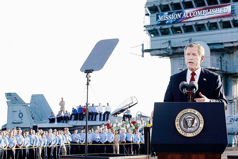 George W. Bush on an air craft carrier in front of the notorious "Mission Accomplished" sign.