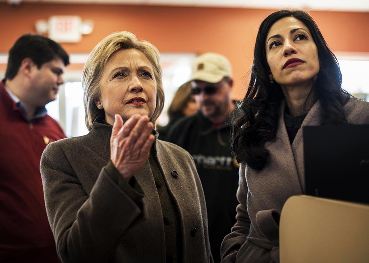 Meeting voters and picking up food for the road, former Secretary of State Hillary Clinton, accompanied by Senior Staffer Huma Abedin, stops at a Dunkin' Donuts in Manchester, New Hampshire on Sunday, February 7, 2016. 
