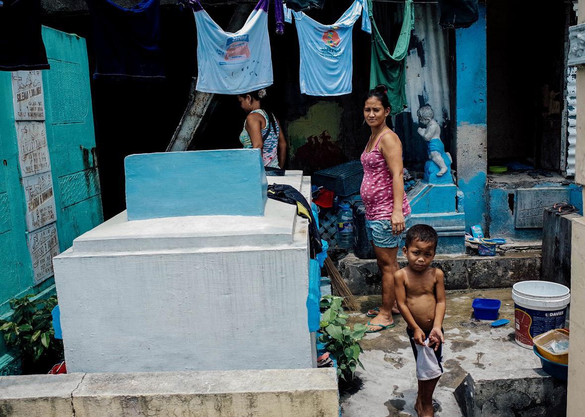 Residents of the Manila North cemetery make their living caring for the  deceased.