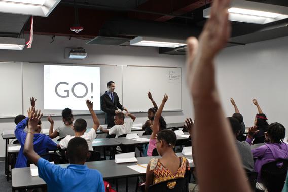 Math teacher Robert Biemesderfer asks students questions during the opening of a BASIS charter school, a brand that has been called one of the most challenging high schools in the country.