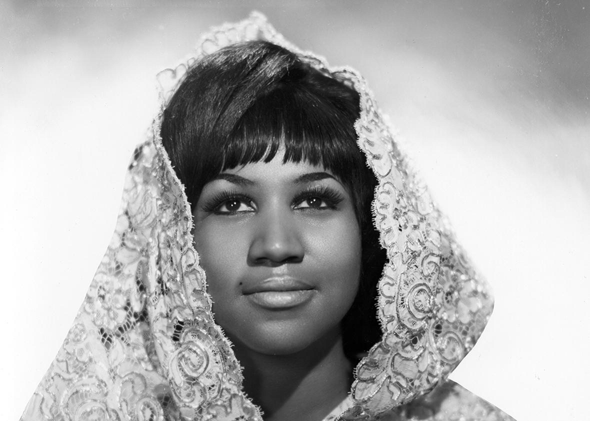 Soul singer Aretha Franklin poses for a portrait wearing a shroud in circa 1967.