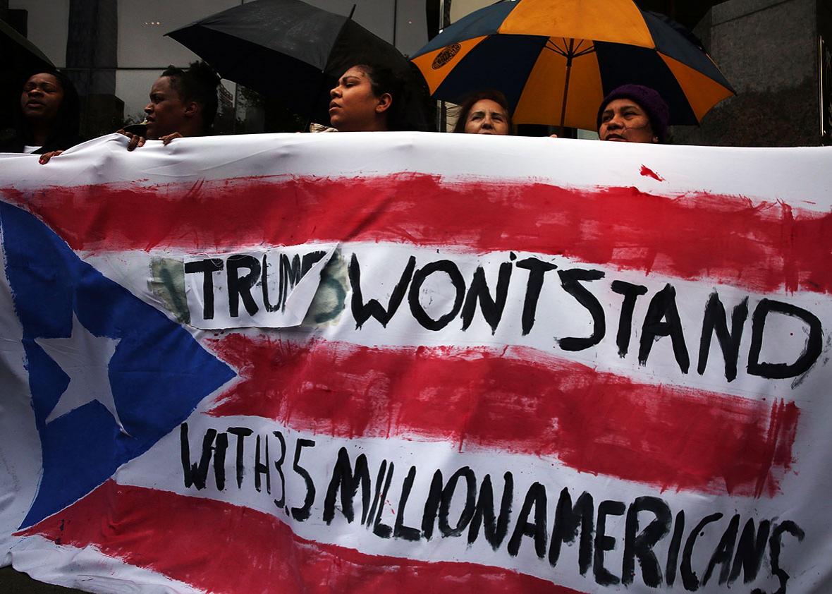 Protesters rally in front of a Trump owned hotel in Manhattan on May 06, 2016 in New York City. 