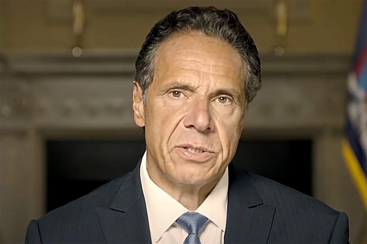 Cuomo looking grim while giving a statement