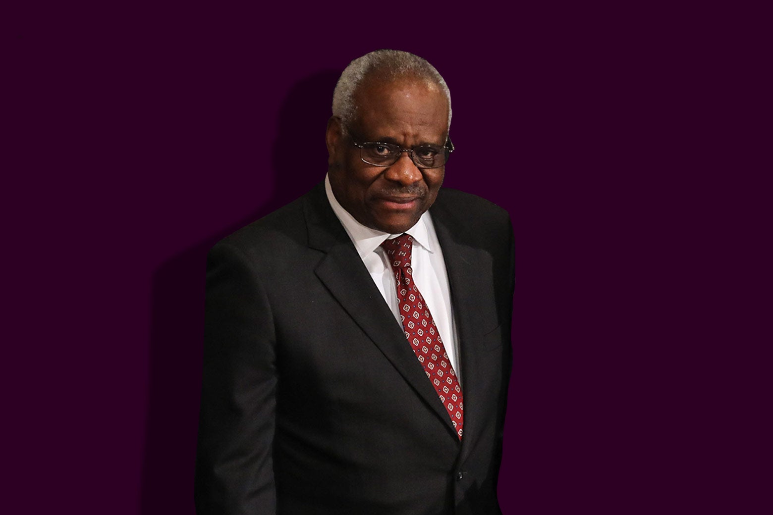 Photo illustration of Supreme Court Justice Clarence Thomas against a purple background.