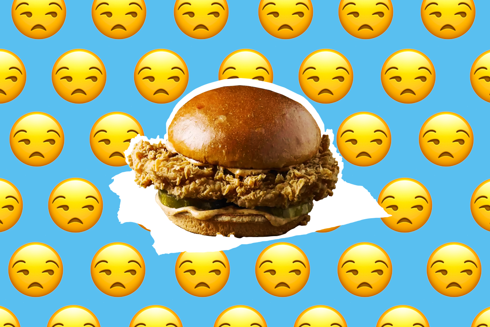 Photo illustration of the Popeyes chicken sandwich surrounded by the "unamused" emoji.