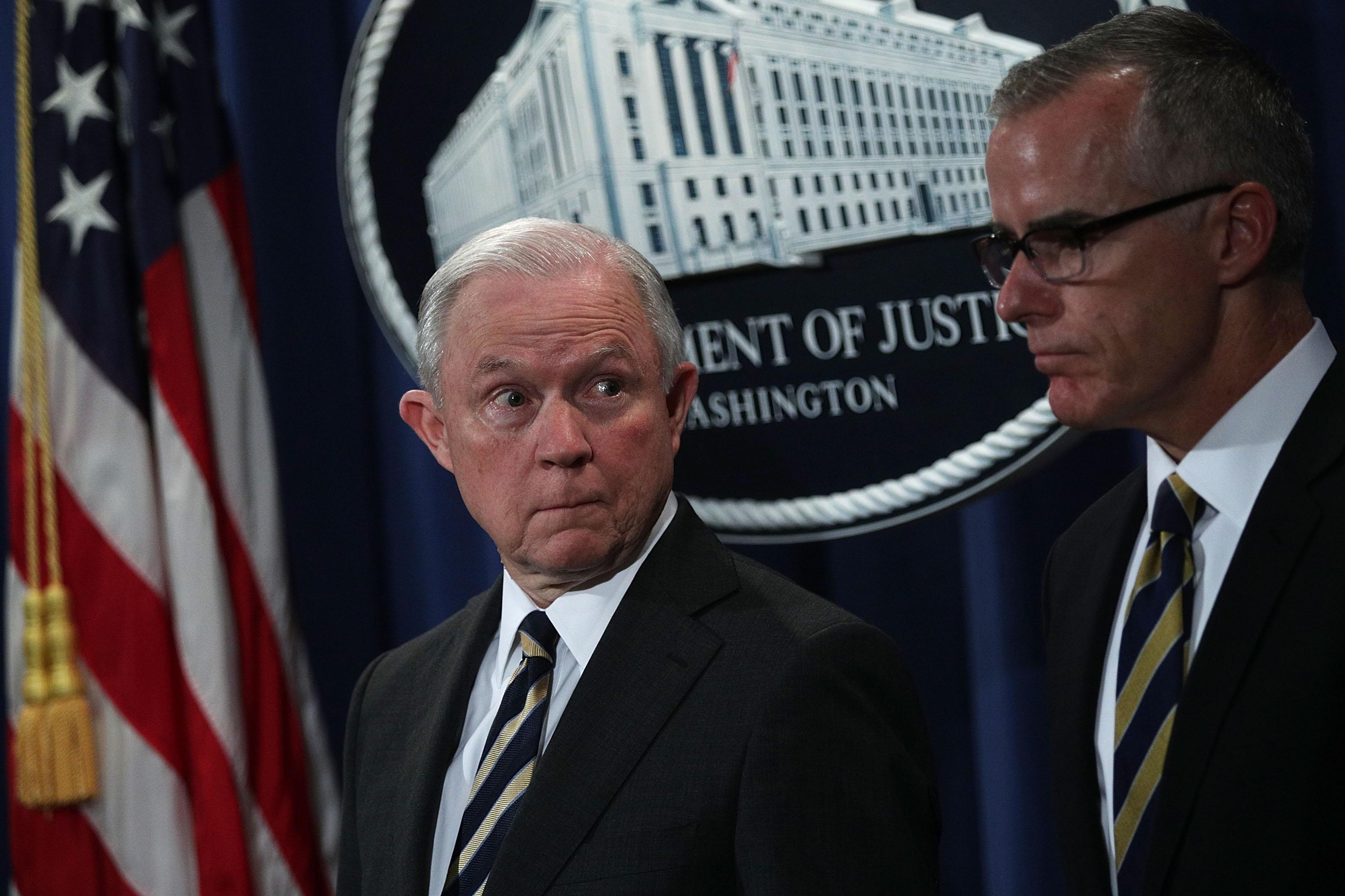 WASHINGTON, DC - JULY 13:  U.S. Attorney General Jeff Sessions (L) and Acting FBI Director Andrew McCabe (R) during a news conference to announce significant law enforcement actions July 13, 2017 at the Justice Department in Washington, DC. Attorney General Jeff Sessions held the news conference to announce the 2017 health care fraud takedown.  (Photo by Alex Wong/Getty Images)