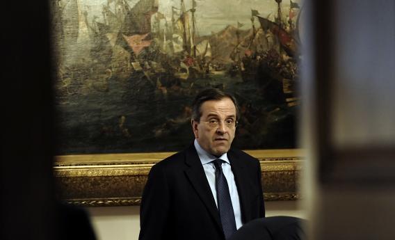 New Democracy Party leader Antonis Samaras waits before an emergency meeting at Greek Prime Minister Lucas Papademos' office in Athens