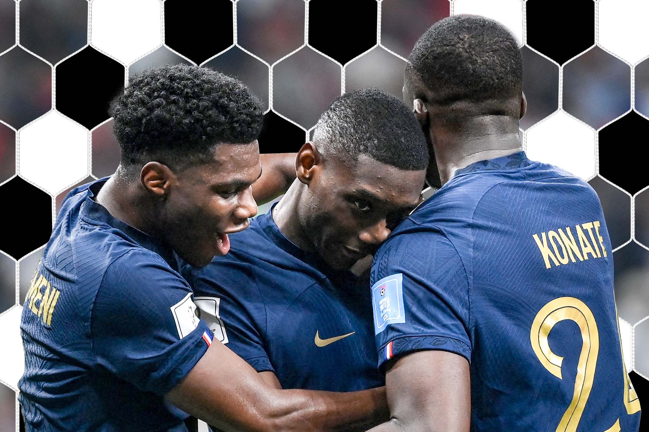 Randal Kolo Muani gets hugged by teammates Aurelien Tchouameni (L) and Ibrahima Konate (R) after scoring France’s second goal.