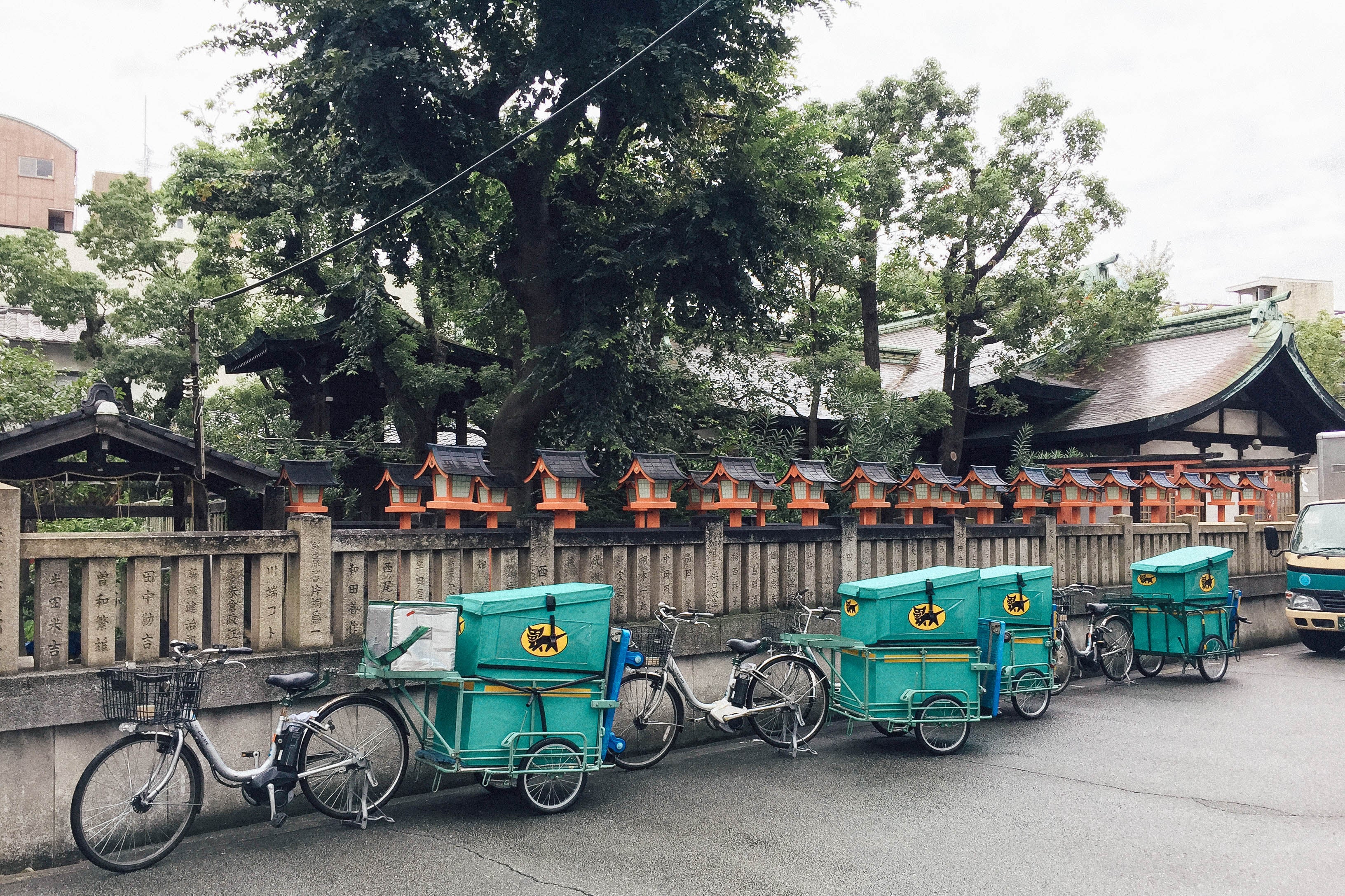 A row of bikes on a city street in Japan