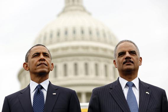 U.S. President Barack Obama and Attorney General Eric Holder attend the National Peace Officers Memorial Service at the Capitol in Washington May 15, 2013.