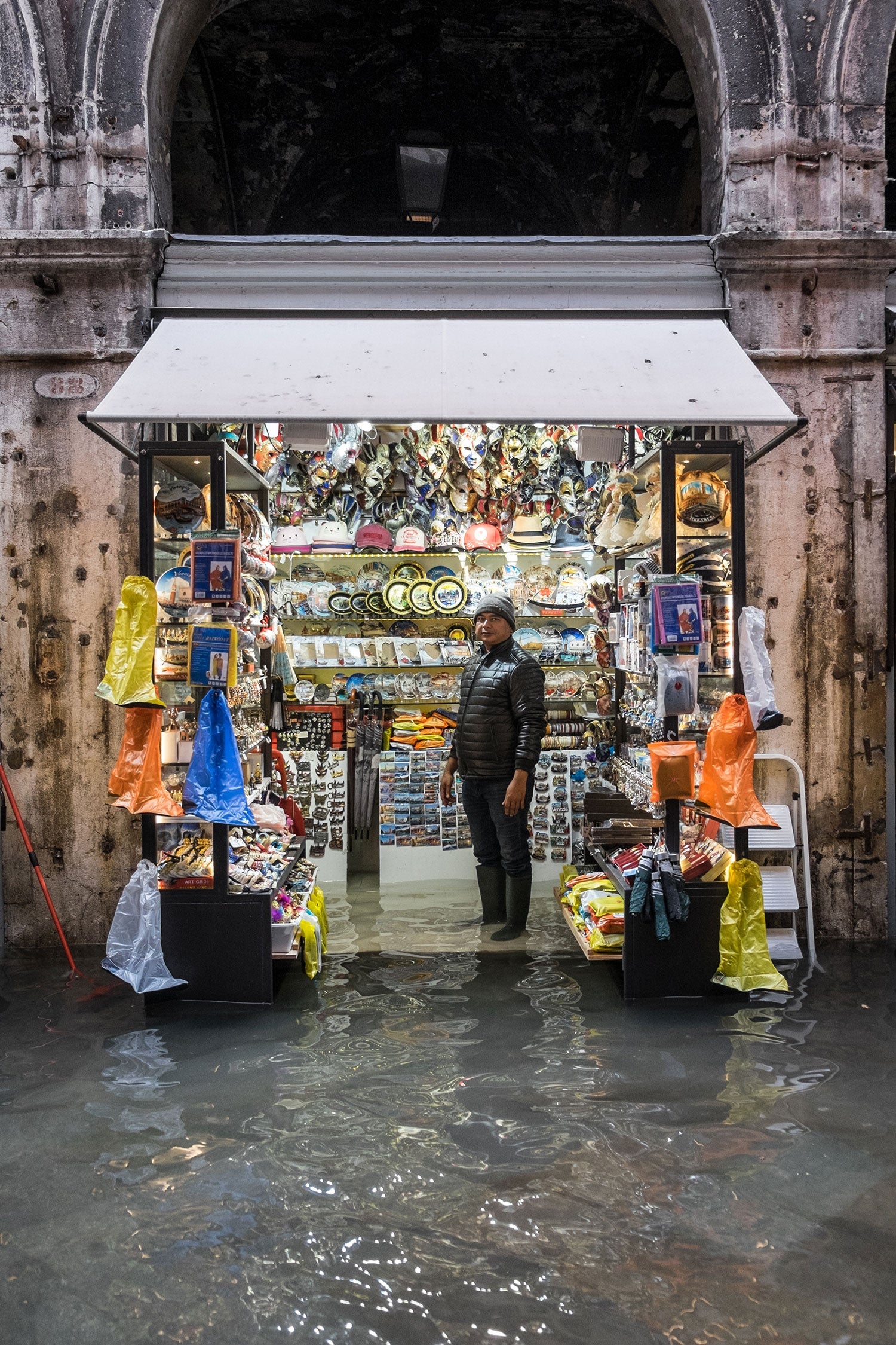 A shop owner portrayed inside his souvenir shop near Rialto Bridge, Venice, Nov 15th 2019.