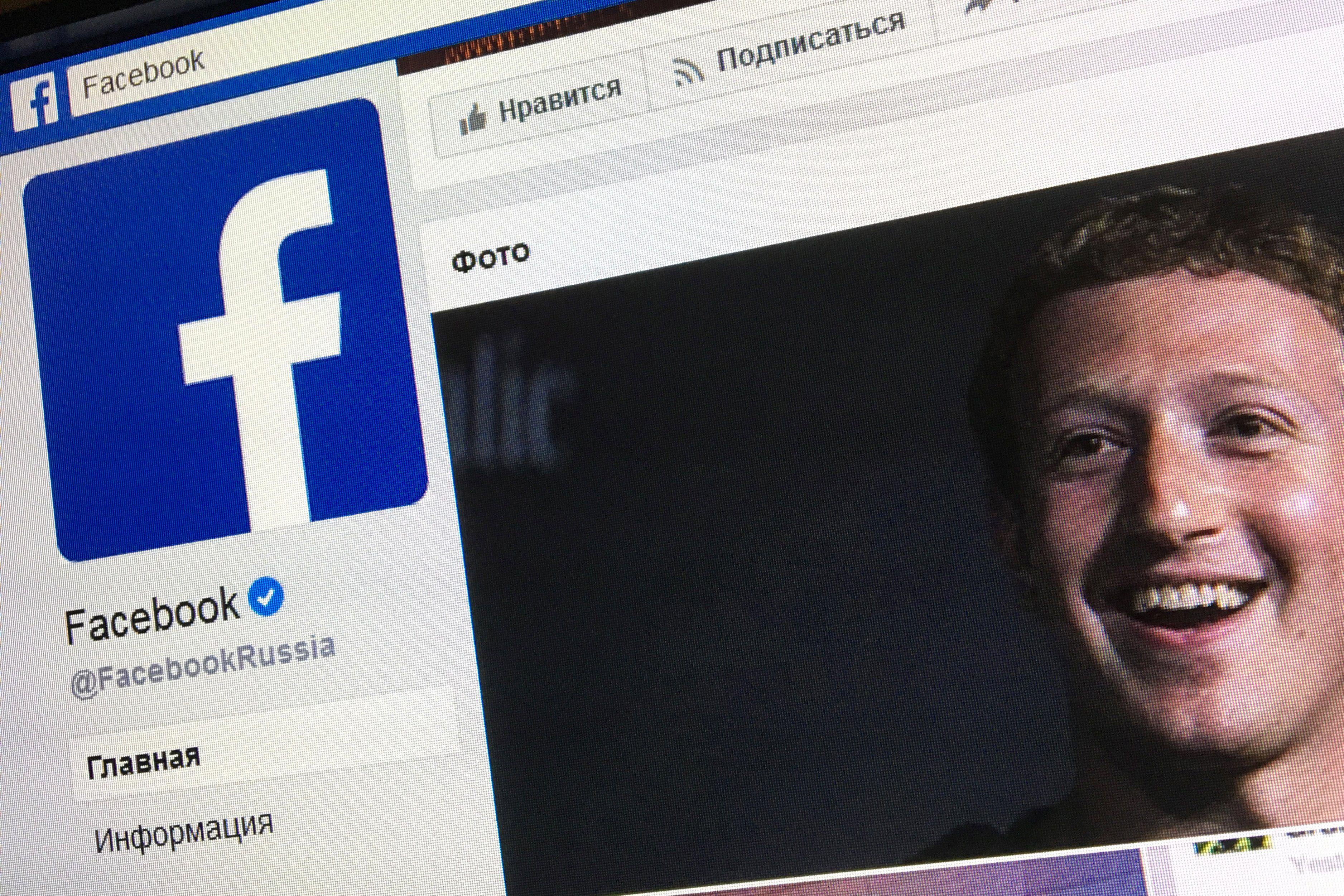 A picture taken in Moscow on March 22, 2018 shows an illustration picture of the Russian language version of Facebook about page featuring the face of founder and CEO Mark Zuckerberg. 