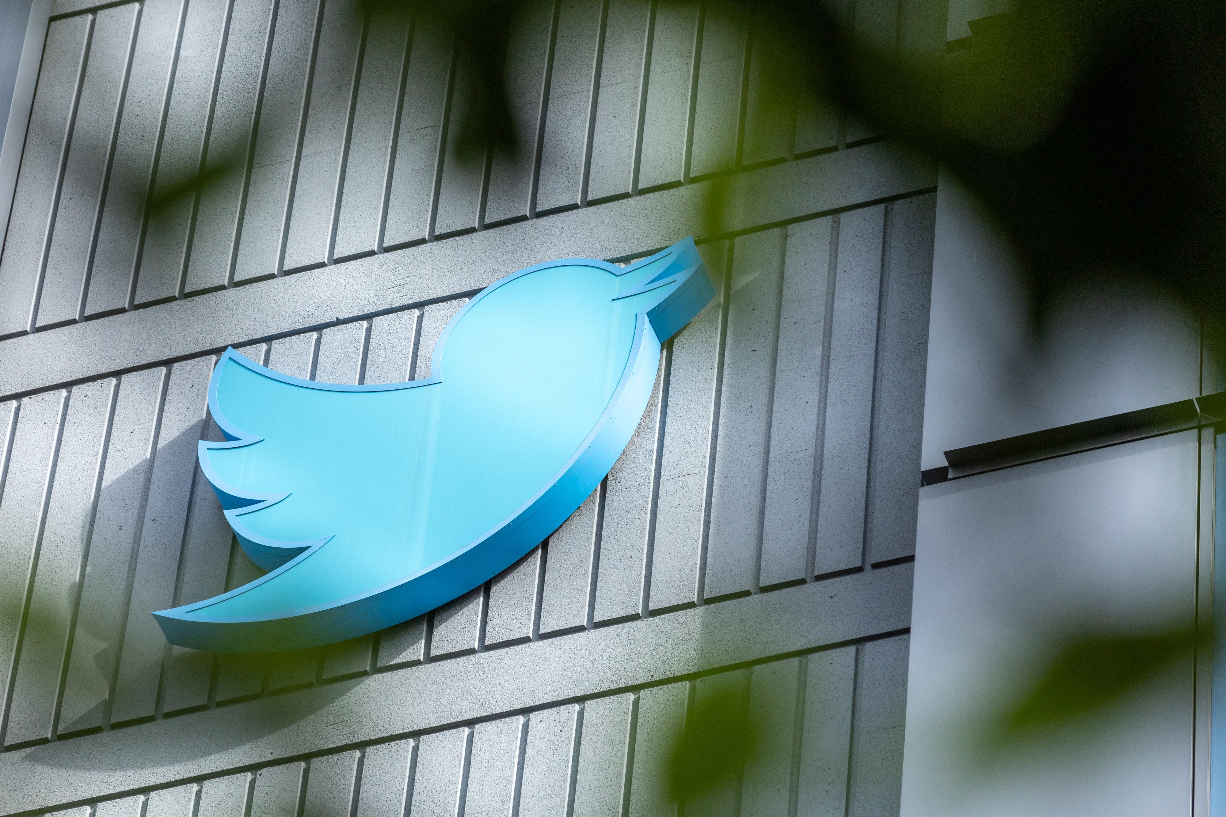 The Twitter logo on the side of a building