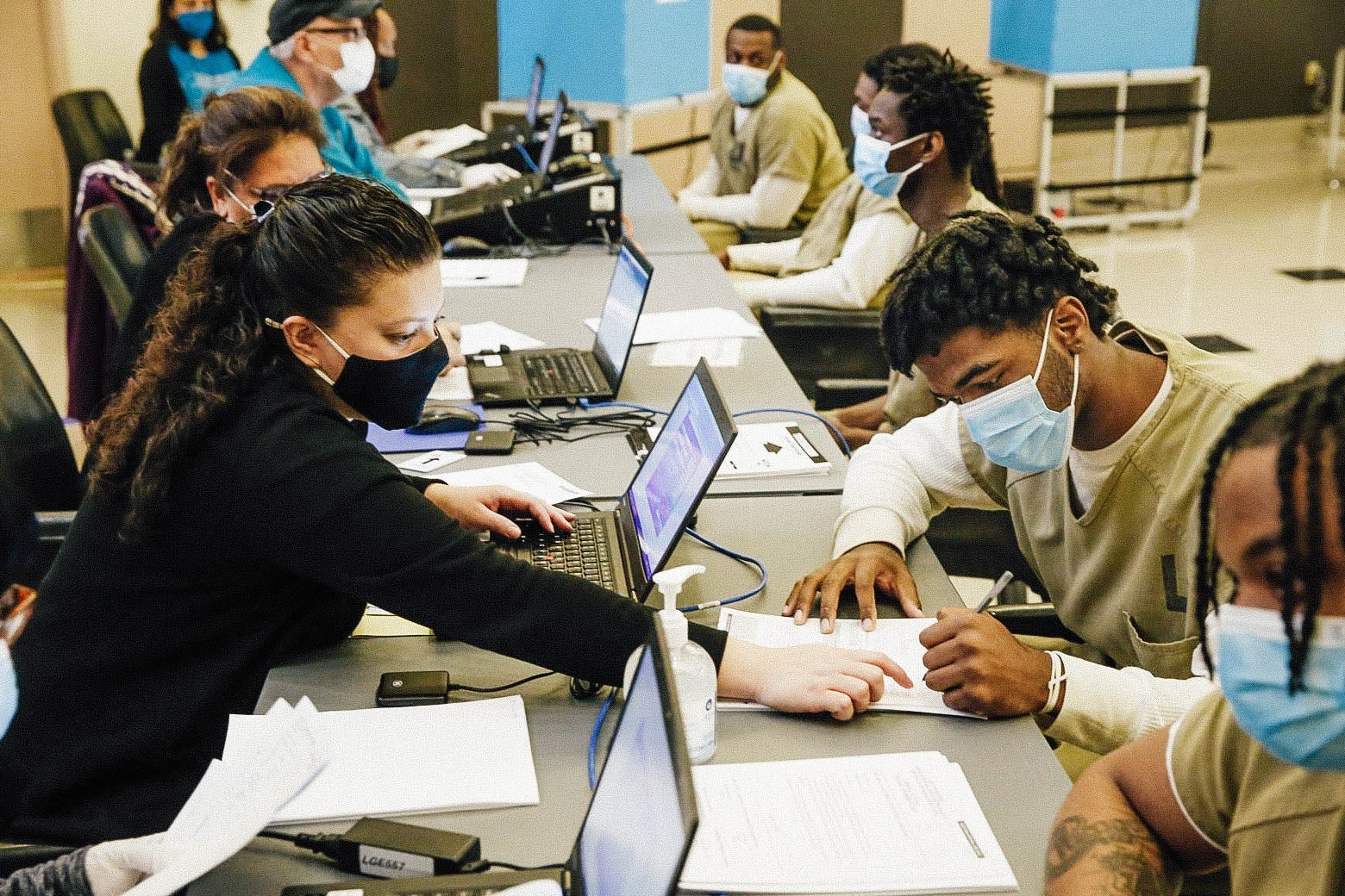Cook County jailers filling out voting forms.