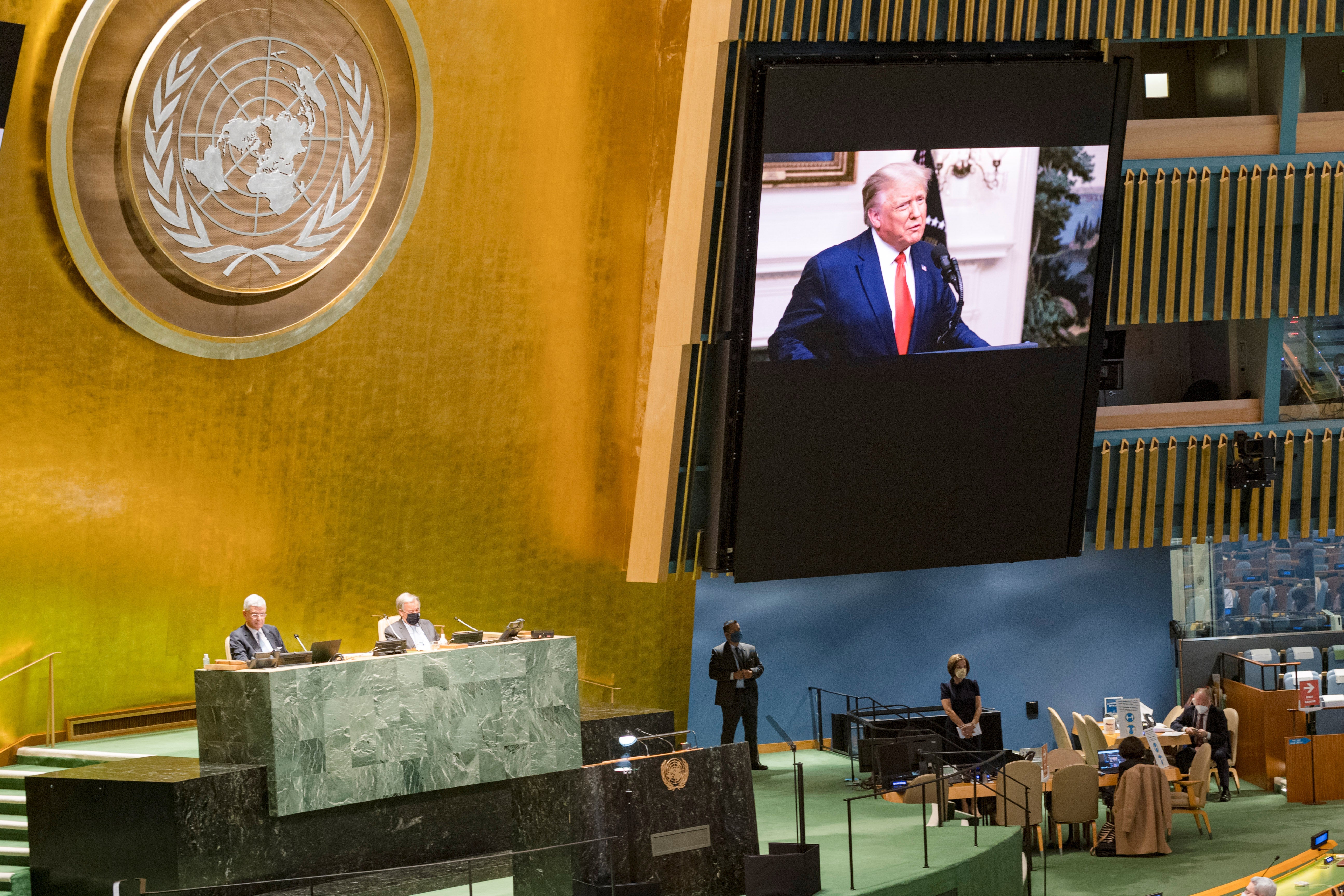 Trump is seen on a screen inside the U.N. headquarters.