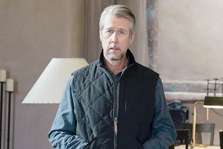 A man in a quilted vest stands slack-jawed.