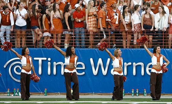 The University of Texas pom squad fires up the student cheering section during a Texas Longhorns football game.