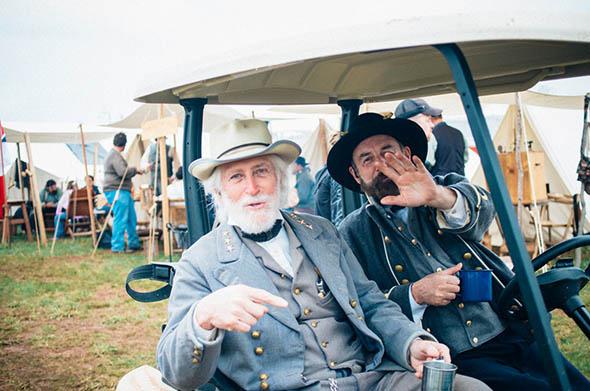 The Robert E. Lee re-enactor travels between tents at the main camp site in Appomattox, Virginia.