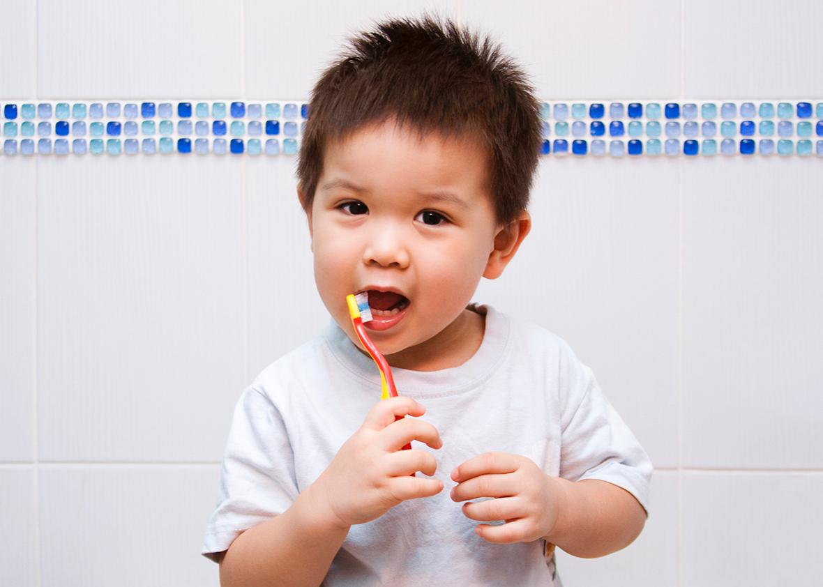 toddler brushing teeth. 