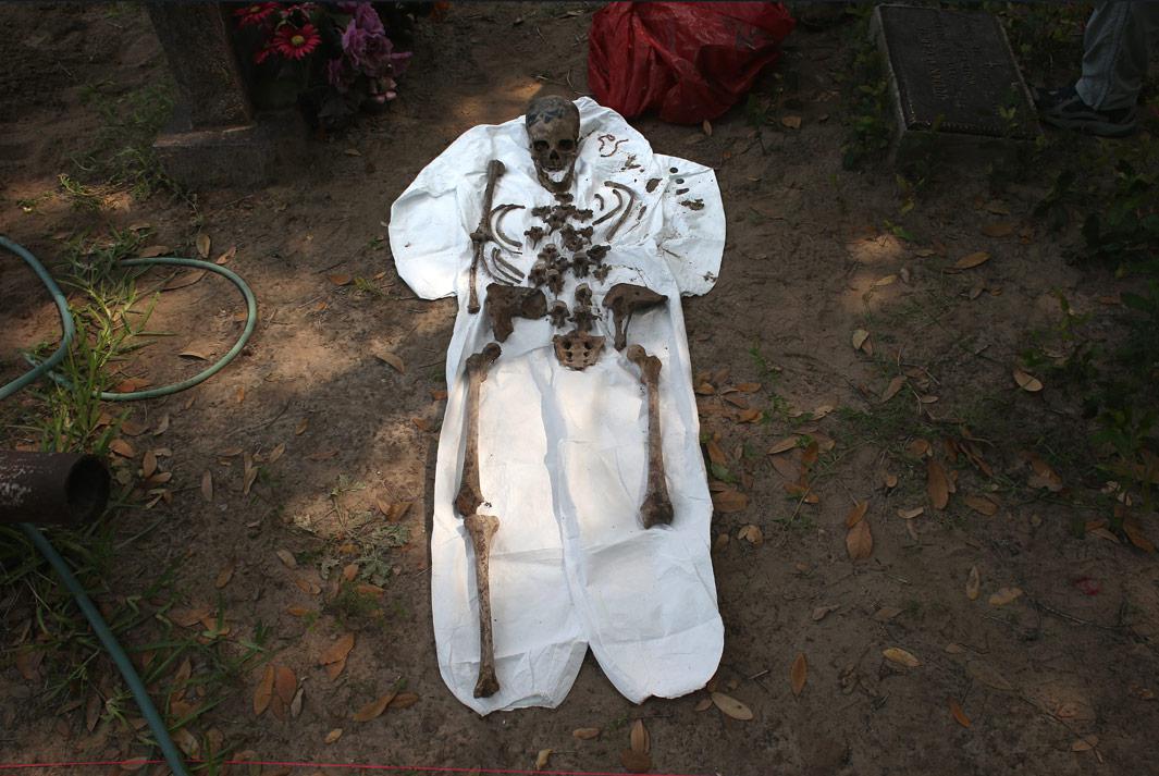 Falfurrias, Texas An unidentified immigrant's bones are reassembled after the remains were exhumed from a gravesite on May 22, 2013 in Falfurrias, Brooks County, Texas. In Brooks County alone, at least 129 immigrants perished in 2012, most of dehydration while making the long crossing from Mexico. Teams from Baylor University and the University of Indianapolis are exhuming the bodies of more than 50 immigrants who died, mostly from heat exhaustion, while crossing illegally from Mexico into the United States. The bodies will be examined and cross checked with DNA sent from Mexico and Central American countries, with the goal of reuniting the remains with families.  
