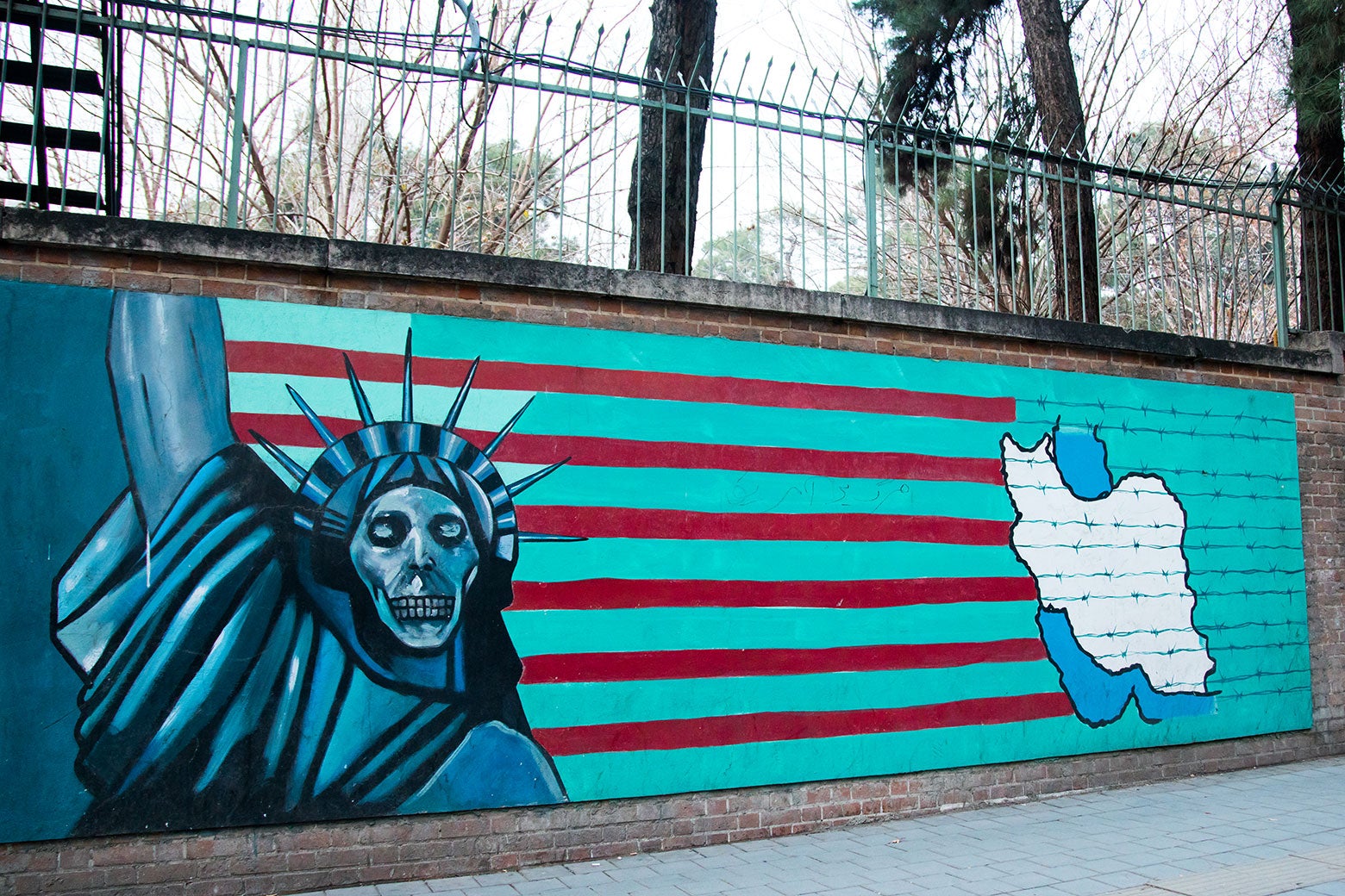 Anti-American mural depicts a skeletonized Statue of Liberty skeleton on the wall of the former U.S. Embassy in Tehran in December 2015.