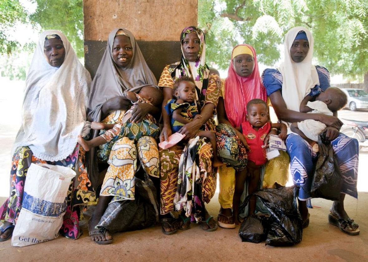 Children and mothers await care at a health post in the Kebbi st