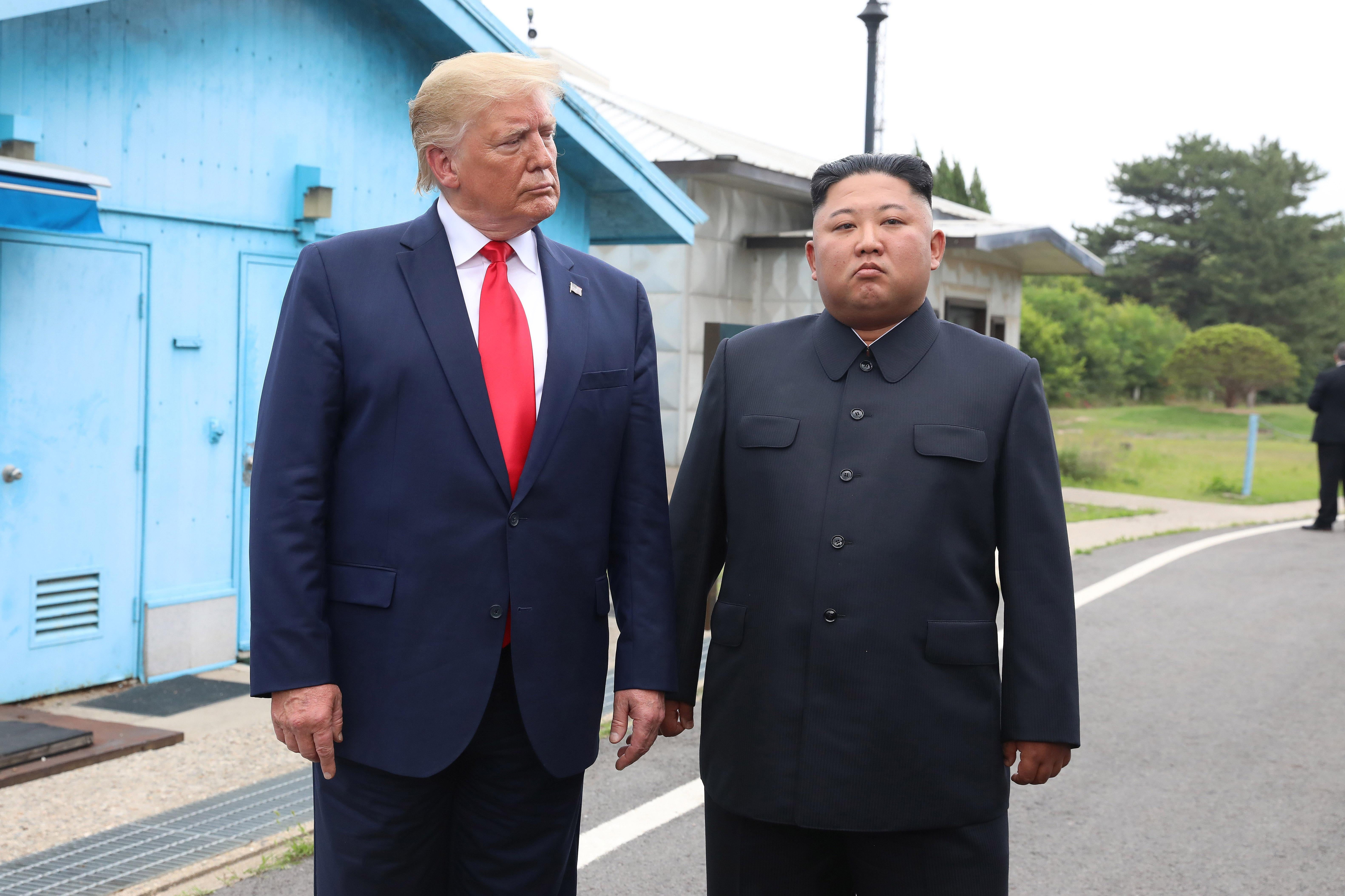 North Korean leader Kim Jong Un and President Trump inside the demilitarized zone (DMZ) on June 30, 2019 in Panmunjom, South Korea. 