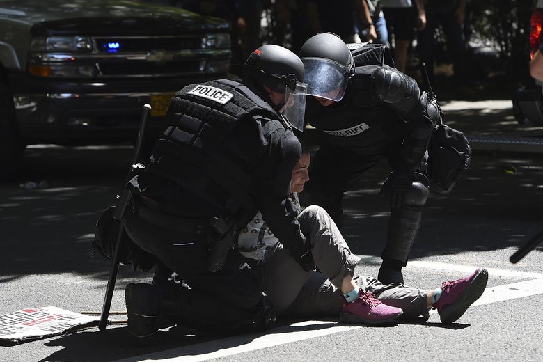 Portland Police handcuff a counterprotester.
