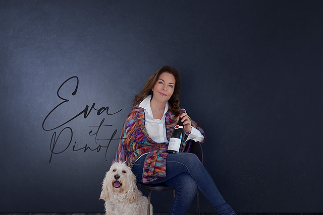 Eva Reh sitting with her trusted pooch, Pinot, by her side.