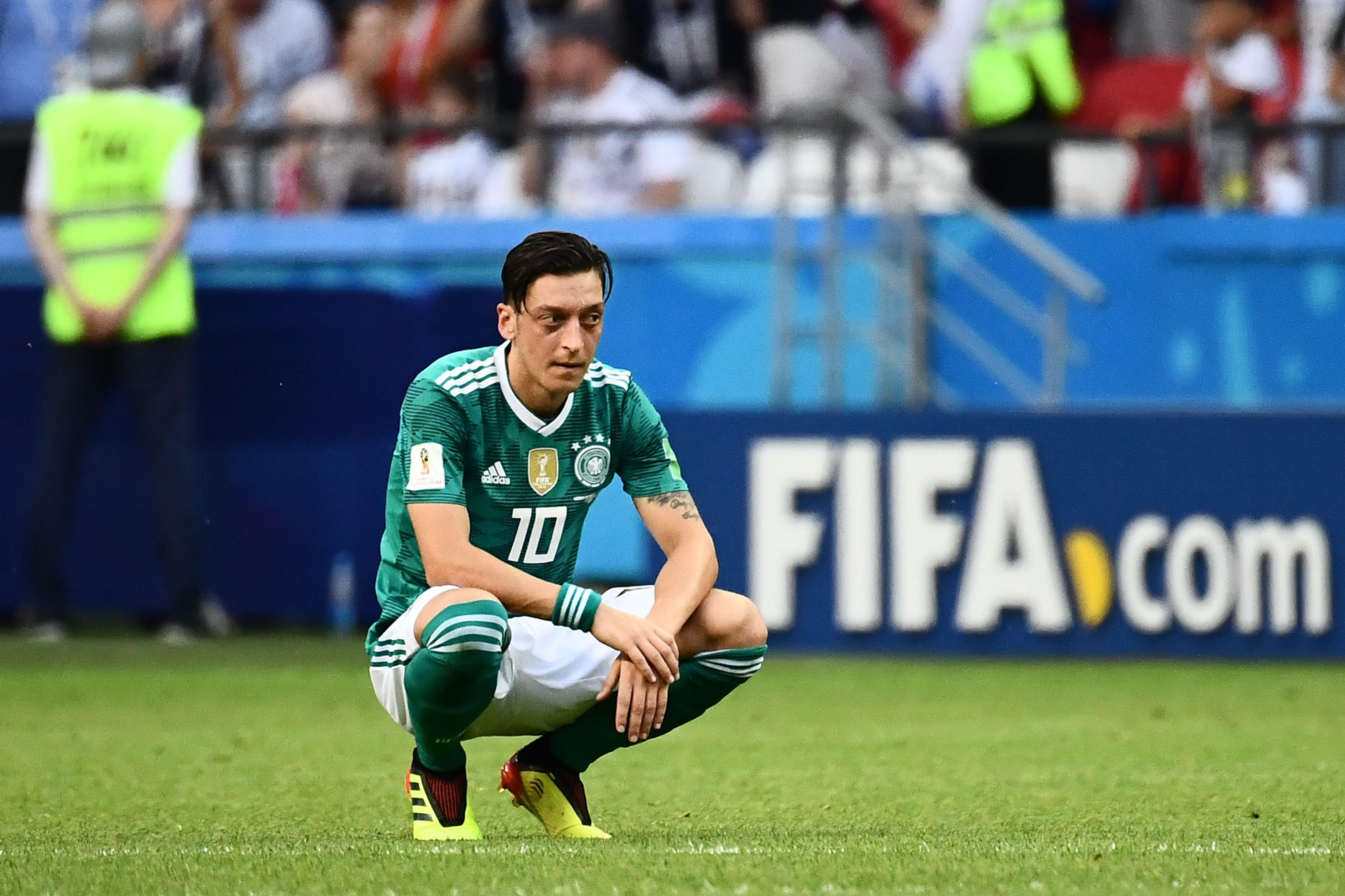 Germany's midfielder Mesut Ozil reacts after South Korea's forward Son Heung-min (unseen) scored the second goal during the Russia 2018 World Cup Group F football match between South Korea and Germany at the Kazan Arena in Kazan on June 27, 2018. (Photo by Jewel SAMAD / AFP) / RESTRICTED TO EDITORIAL USE - NO MOBILE PUSH ALERTS/DOWNLOADS        (Photo credit should read JEWEL SAMAD/AFP/Getty Images)