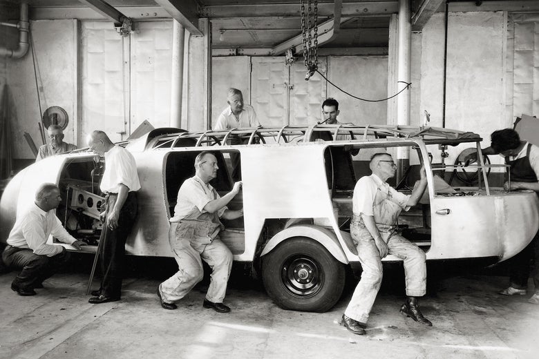 Men working on the Dymaxion Car. 