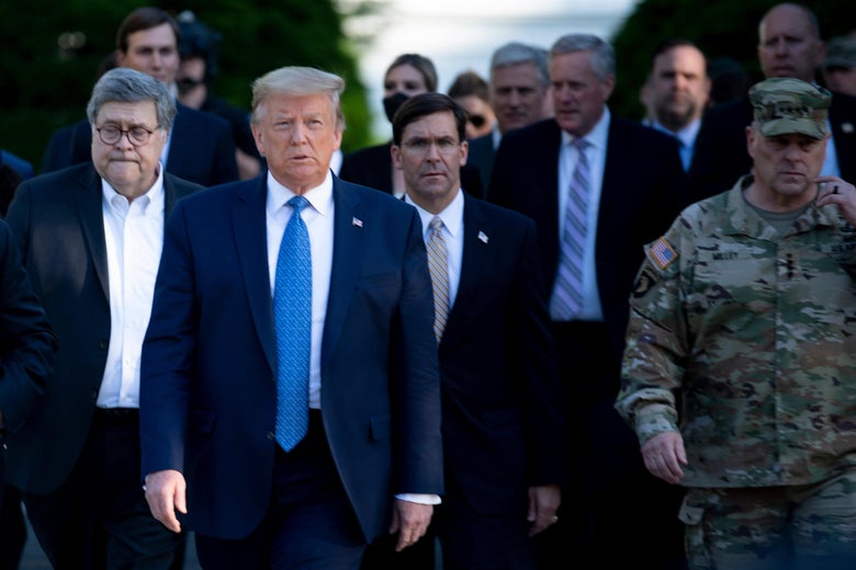 Barr, Trump, Esper, and Milley walk side by side in front of a crowd.