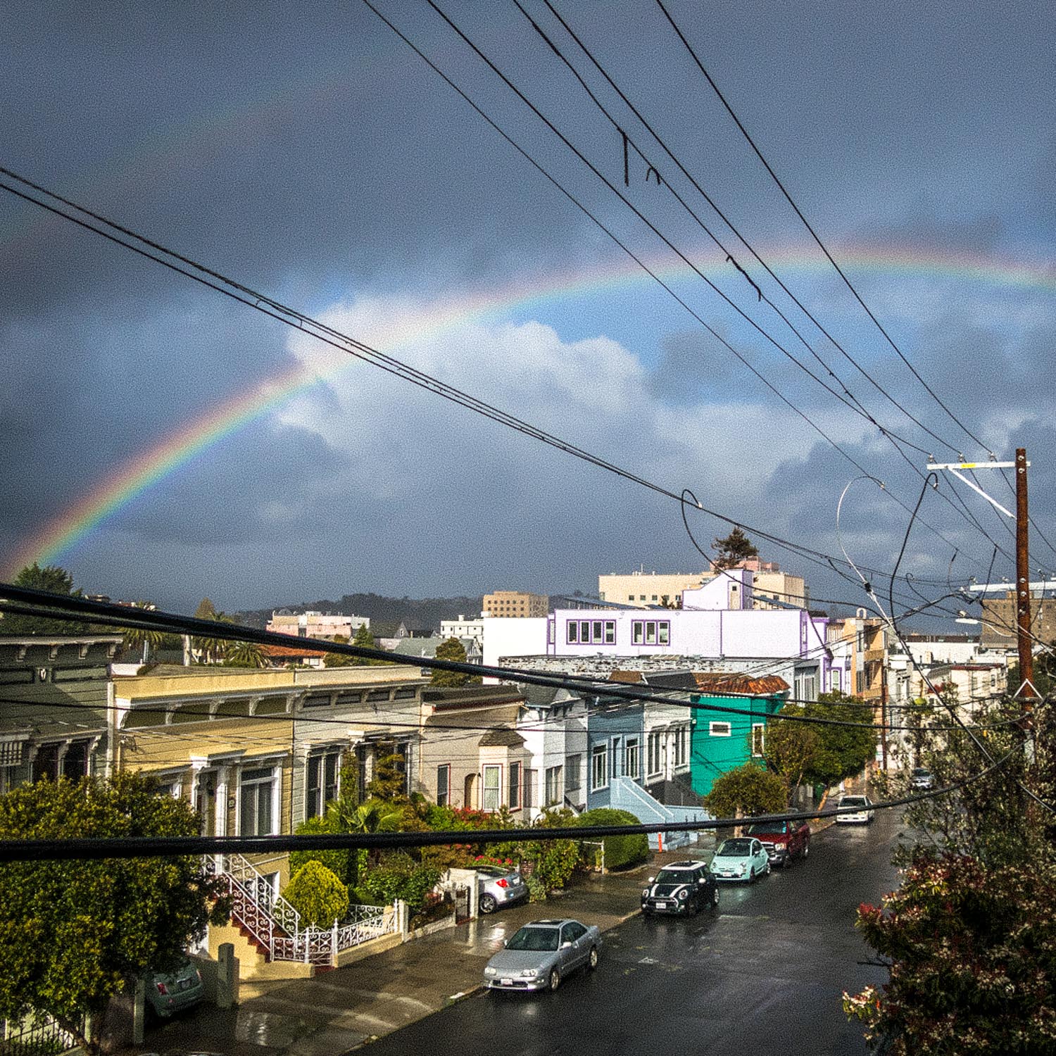 A rainbow over a wet street
