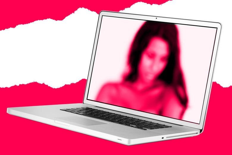 A laptop with a risqué photo of a woman on screen.