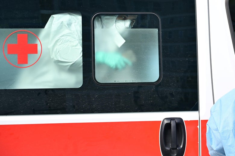 A man arrives in an ambulance at a pre-triage medical tent in Italy.