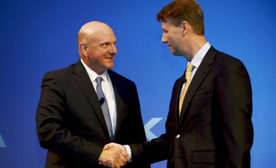 Microsoft CEO Steve Ballmer shakes hands with Nokia chairman Risto Siilasmaa after Nokia announced the sale of its mobile phone unit to Microsoft for $7.2 billion, bringing to an end its days as a phone maker. 