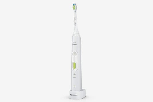 White and green Philips Sonicare Healthy White electric toothbrush.
