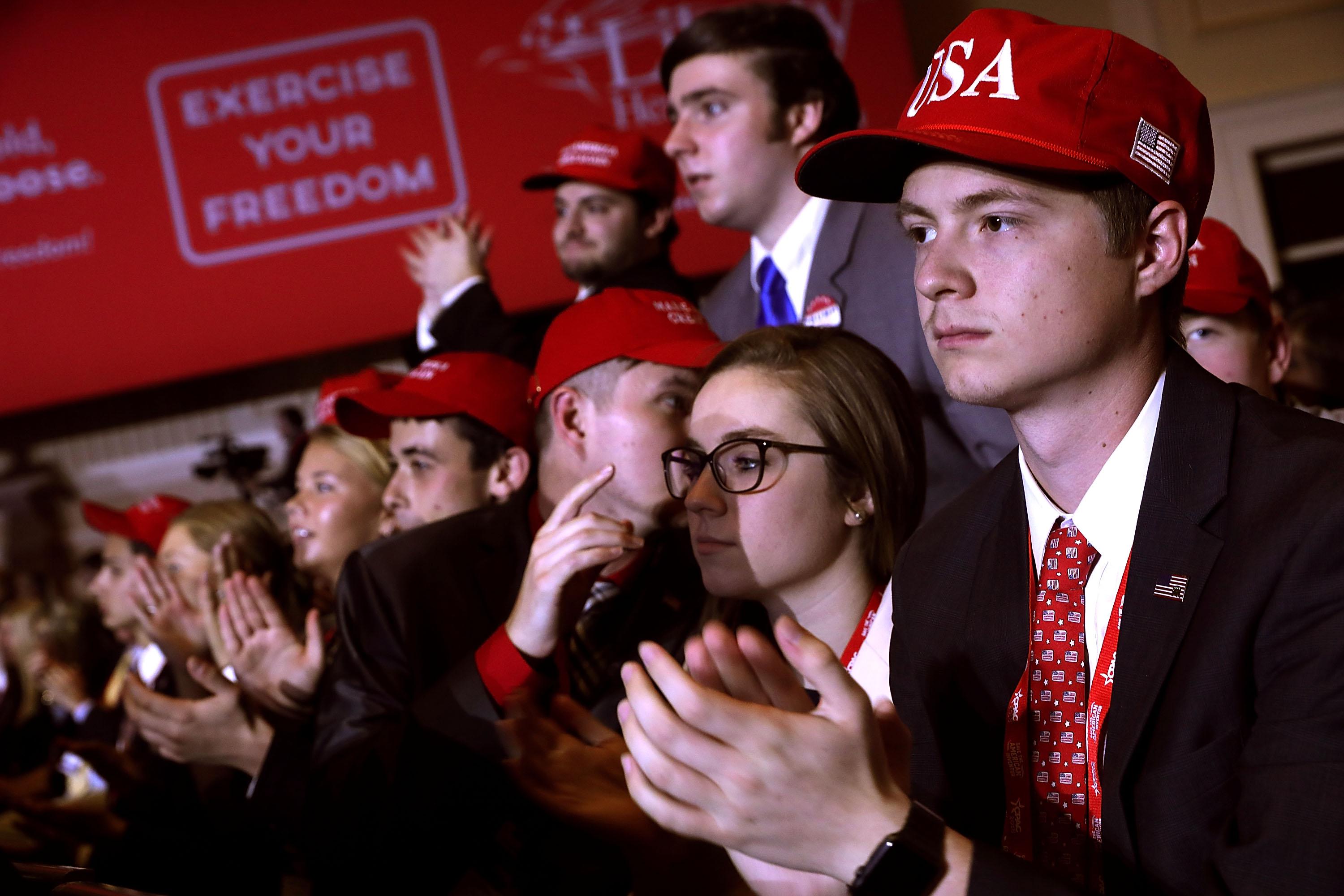 Young supporters cheer as President Donald Trump addresses CPAC.